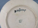 a white plate with a black writing on it