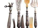many different types of knives and spoons on a white background