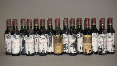 plusieurs bouteilles de vin sont alignées sur une table