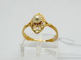 an image of a gold ring with a pearl in the center