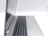 a close up of a laptop computer on a white surface