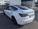 the tesla model s is parked in front of a building