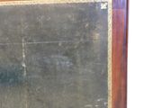 a blackboard with writing on it in front of a white wall
