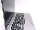 a close up of a laptop computer on a white surface