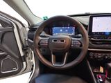 the interior of a car with a steering wheel, dashboard, and touch screen