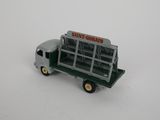 a toy truck that has a bunch of items in the back