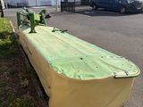 a yellow boat that is sitting on the side of the road