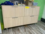 a cabinet that has a bunch of items on top of it