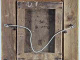 a picture of a wooden box with wires in it