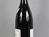 a bottle of wine that is sitting on a table