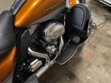a close up of a motorcycle parked in a garage