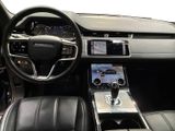the interior of a car with a steering wheel, dashboard, and dashboard controls