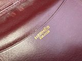 the inside of a leather purse with a label on it