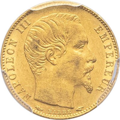 gros plan d'une pièce d'or portant un visage de femme
