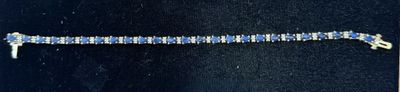 an image of a blue and white bracelet with diamonds