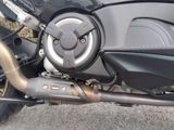 a close up of a motorcycle with a exhaust pipe