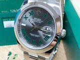 rolex day date watch in stainless steel with green roman numerals