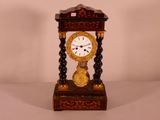 a small clock that is sitting on a table