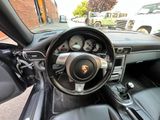 the interior of a car with a steering wheel and dashboard