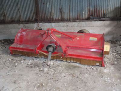 a red machine that is laying on the ground