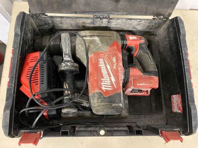a tool in a toolbox that is sitting on the floor