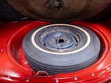 a tire that is sitting in the back of a truck