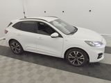 a picture of a white car parked in a garage