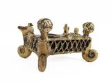 brass figurine of a bed with four birds on it