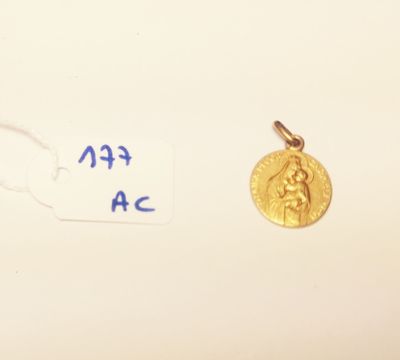 a gold coin with a picture of a woman on it
