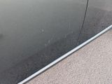 reflection of a car in a mirror on the side of the road