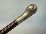 a close up of a cane with a decorative design on it