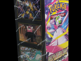 a box of pokemon trading cards on a black background