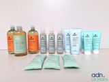 many different types of skin care products sitting on a table