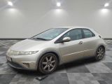 a picture of a silver honda civic car in a garage
