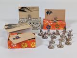 a lot of small metal figurines sitting on a table