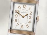 an image of a close up of a wrist watch on a white surface
