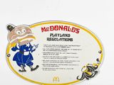 a sign on the side of a refrigerator that says mcdonald ' s