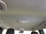 the interior of a car with the sunroof down and the back seats down