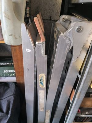 several pieces of metal are stacked on top of each other in a room
