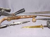 a lot of old tools that are laying on a table