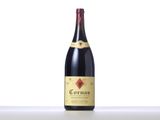 a bottle of red wine sitting on top of a table