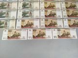 many bills of different colors and shapes on the table