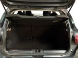 the back of a car with the trunk open and the seats down