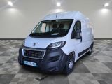 the white van is parked on a checkered floor in a room