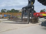 a large crane that is sitting on the side of the road