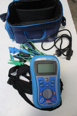 a blue bag and a blue and black bag on a table