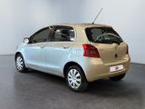 a picture of a small car parked in a showroom