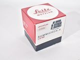 a red and white box with a white label on it