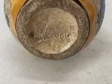 an image of a close up of a vase on a table