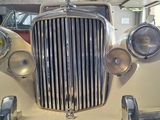 a close up of the front of a vintage car